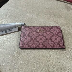 NWT Kate Spade small zip wristlet.  Color is called spade flower